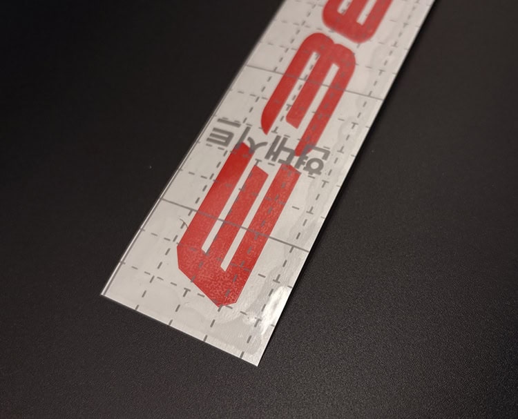 Close-up of BMW E36 decal lettering showing the enlarged E