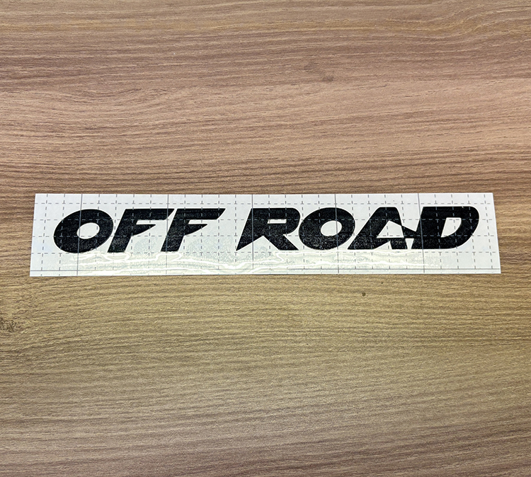 Close-up of OFF ROAD decal rounded F corner detail
